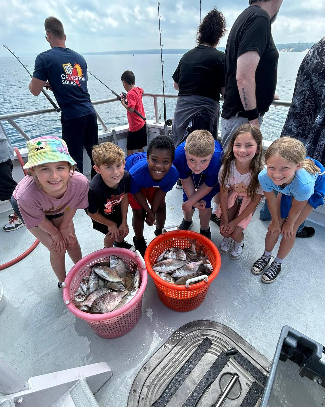 Kids group with baskets of porgy and sea bass on Celtic Quest, Port Jefferson