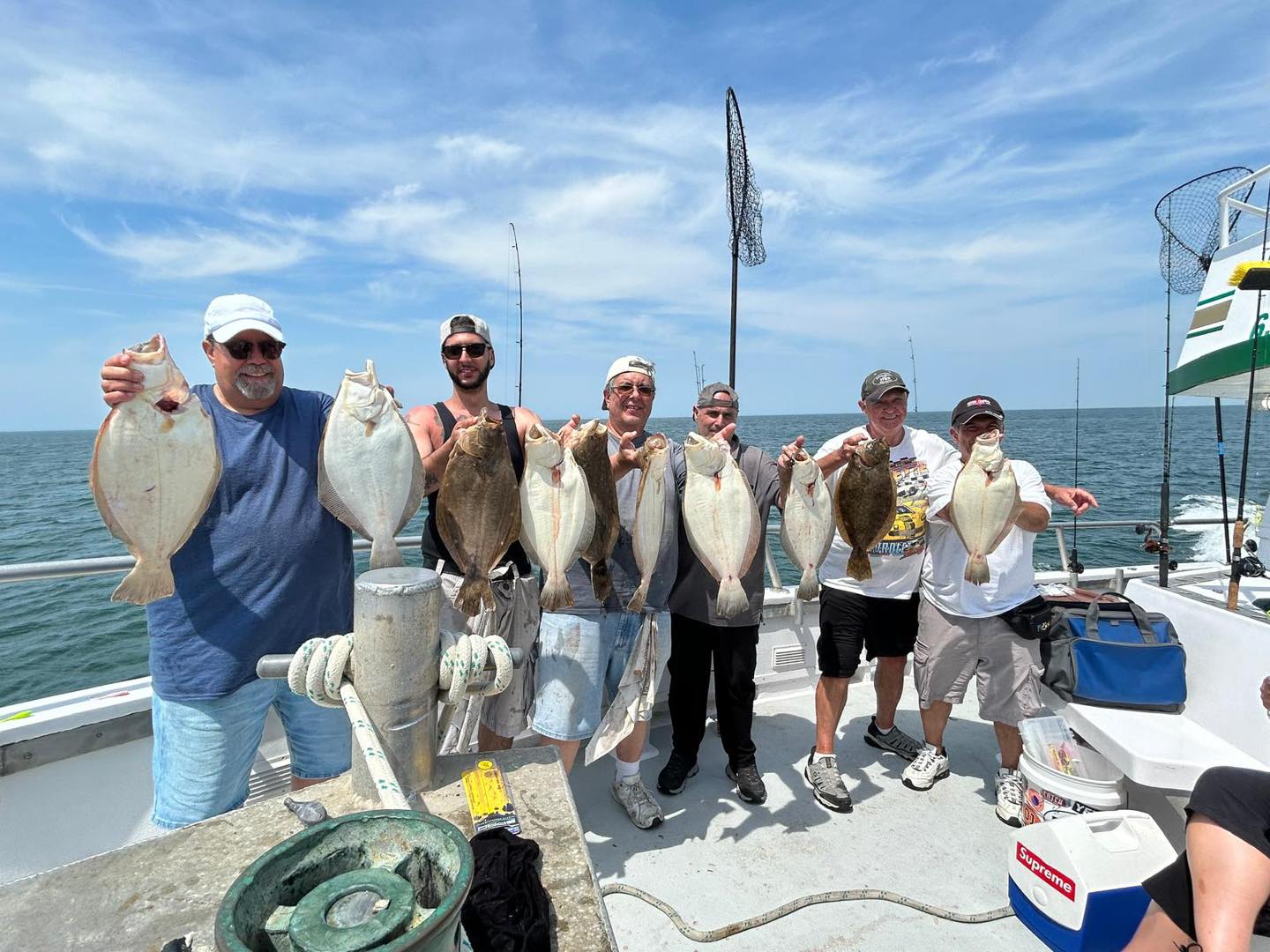 Five anglers holding fluke catches on Celtic Quest open boat trip, Long Island Sound