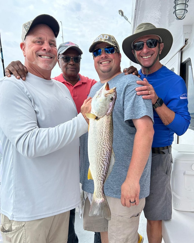 Four men with weakfish catch on Celtic Quest fishing trip